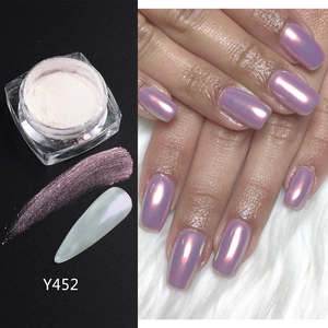 Macro detail of Y452 aurora nail powder showing white pearl finish and purple glow