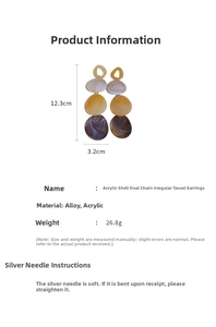 Macro detail of acrylic shell oval chain earrings showing length and layered texture