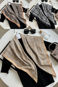 Detailed pattern view of elegant houndstooth silk scarves in brown and black options