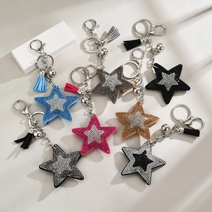 Sparkling star-shaped keychains with rhinestones and matching tassels in various colors