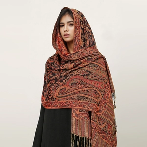 Detailed paisley pattern on dark brown cashmere-feel shawl with elegant tassels