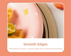 Detail of pink ceramic plate with smooth edges and yellow star patterns