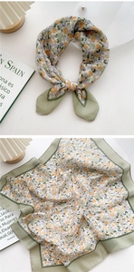 Detail of floral linen-cotton square scarf with contrast green border and soft texture