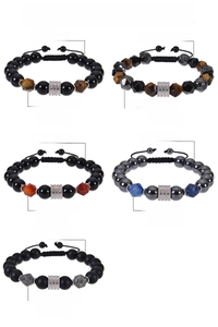Macro view of 10mm faceted obsidian and tiger eye beads on stainless steel bracelets