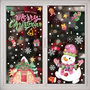 Christmas window decals with snowman, candy house and snowflakes for holiday party decor
