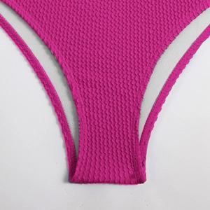 Macro shot of rose pink waffle texture bikini bottom with neat white inner lining