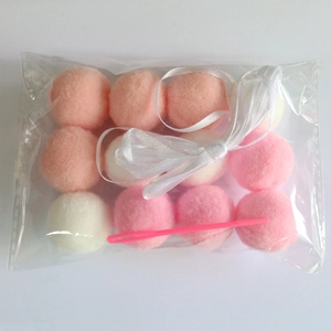 DIY colorful pom pom garland kit with pink and white plush balls for birthday party decor