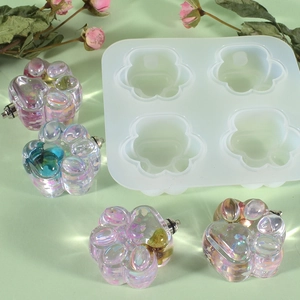 Detail of four-hole cat paw silicone mold with iridescent resin crafts and glitter