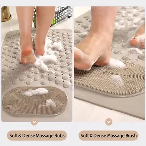 Gray non-slip bathroom mat with massage nubs and soft bristles for foot scrubbing
