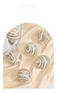 Detail of golden sequined Christmas balls with white lace and pearls on silk