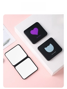 Detail of portable double-sided folding mirror with cat ear pattern and Love Day text