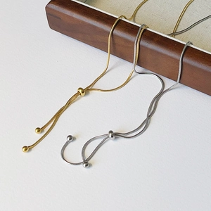Adjustable gold and silver snake chain necklaces with sliding bead clasp detail