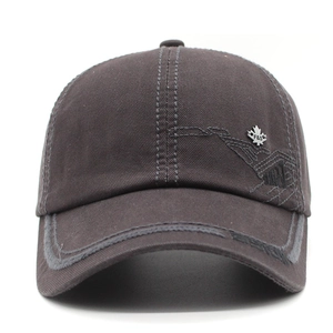 Dark brown cotton canvas baseball cap featuring a metal maple leaf badge and grey stitching