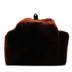 Detailed view of thick dark brown faux fur texture on a warm winter trapper hat