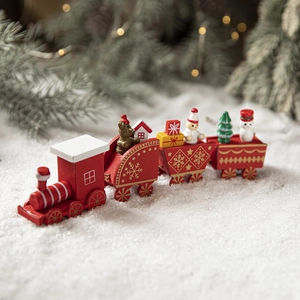 Festive red wooden Christmas train decoration with miniature snowman and gift carriage