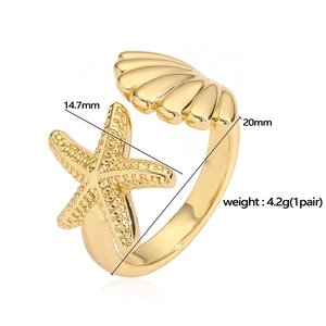 Detail showing dimensions of gold starfish and seashell ring at 14.7mm and 20mm width