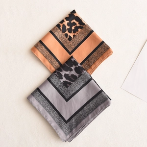 Elegant leopard print square silk scarf in brown and grey with geometric patterns