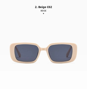 Close-up of beige rectangular sunglasses with dark grey lenses and UV protection