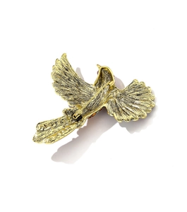 Detailed back view of gold hummingbird brooch showing fine feather texture and pin clasp