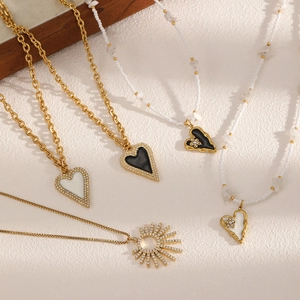 Luxury heart and sunburst pendant necklace set with crystal diamonds and gold plated finish
