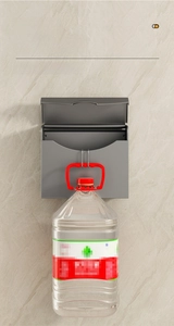 Strong weight-bearing test of a wall-mounted grey paper box on marble tile