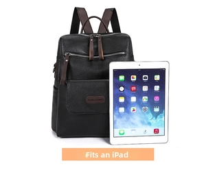 Detail of black pebbled leather backpack showing capacity to fit a standard iPad