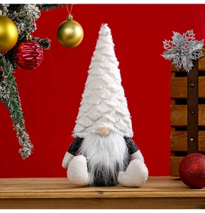 Detailed view of a Nordic Christmas gnome plush with white faux fur hat on festive red background