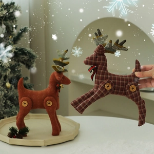 Christmas reindeer fabric ornaments with bells and button legs for holiday tabletop decoration