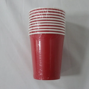 Close-up of stacked red disposable paper cups wrapped in clear plastic protective film