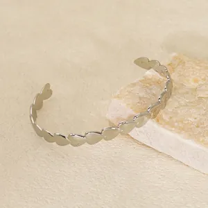 Minimalist silver stainless steel open bangle with continuous heart-shaped link design