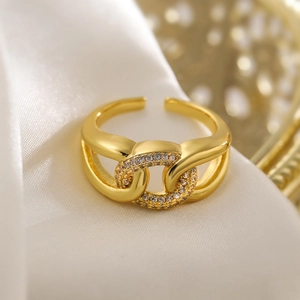 Elegant 18K gold plated chain link ring with sparkling cubic zirconia on white silk