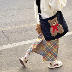 Quilted heart pattern tote bag with teddy bear pendant and adjustable shoulder strap