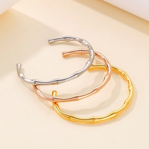 Detailed view of bamboo joint open bangles in gold, rose gold and silver finishes