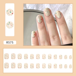 Detail of R575 press-on nails with colorful specks and 24-piece full set display
