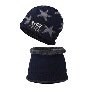 Detail of warm winter knit beanie and neck warmer set with star embroidery and fleece lining