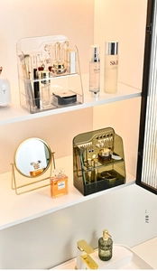 Macro view of tiered PET cosmetic organizer with jewelry holes and transparent finish