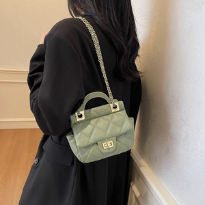 Quilted light green crossbody bag with gold chain strap and elegant top handle for women