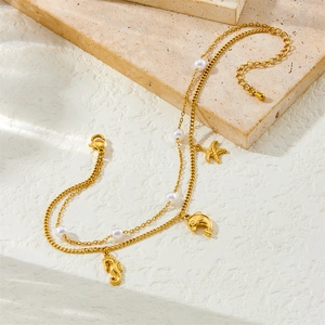 Gold double-layered anklet with starfish, dolphin, seahorse charms and pearls