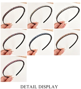 Detail display of skinny wavy rhinestone headbands in seven varied sparkling colors