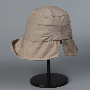 Detail view of khaki nylon bucket hat with neck flap protection and wide brim for sun safety