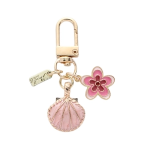 Golden alloy keychain with pink shell and floral charms for bags and car keys