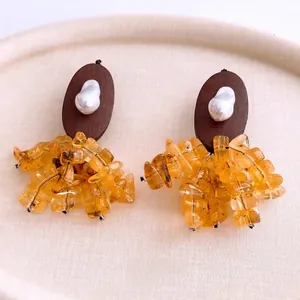 Vintage bohemian oval wood earrings with pearl and amber resin stones in warm tones