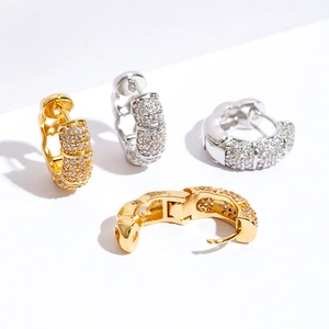 Micro-paved iced out cubic zirconia bamboo hoop earrings in gold and silver plating