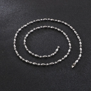 Close-up of polished silver stainless steel oval bead chain with glossy metallic luster