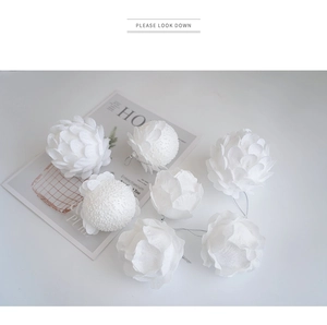 Macro detail of white glitter petal Christmas ornaments with soft layered texture decoration