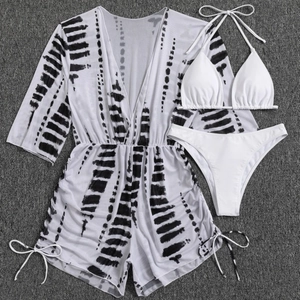 Three-piece bikini set with tie-dye mesh cover-up featuring drawstring and side-tie details
