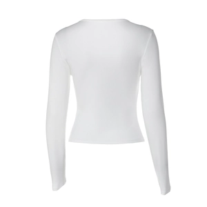 Detailed view of white slim fit long sleeve top with lace trim and ribbed fabric texture