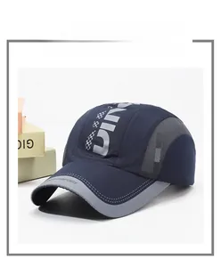 Close-up of breathable mesh fabric and grey stitching on navy blue quick-dry sports cap