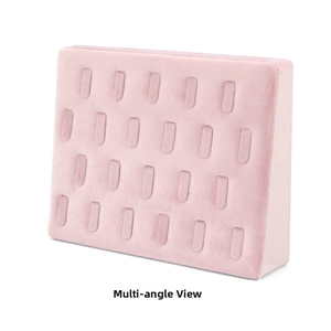 Detailed view of pink velvet jewelry display tray with multiple slots for rings and studs