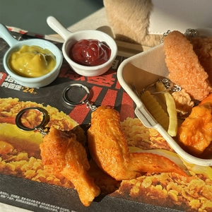 Realistic PVC food keychain set featuring crispy fried chicken and fries on a tray
